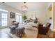 Cozy living room with ample natural light, neutral decor, and designer accents at 8216 Indigo Row, Charlotte, NC 28277