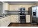 Well-equipped kitchen featuring stainless steel appliances and granite countertops at 8272 Golf Ridge Dr, Charlotte, NC 28277