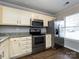 Bright kitchen showcasing granite countertops and stainless steel appliances at 8272 Golf Ridge Dr, Charlotte, NC 28277
