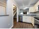 Bright kitchen with granite countertops, stainless steel appliances, and hardwood flooring at 8272 Golf Ridge Dr, Charlotte, NC 28277