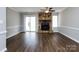 Spacious living room with a stone fireplace and access to the outdoors at 8272 Golf Ridge Dr, Charlotte, NC 28277