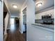 Spacious living room featuring a large window and an open view to the kitchen at 8272 Golf Ridge Dr, Charlotte, NC 28277