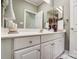 Bathroom featuring a white vanity with storage, decorative accents, and a neutral color scheme at 8405 Olde Troon Dr # 4A, Charlotte, NC 28277