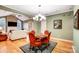 Elegant dining area with a view into the spacious living room at 8405 Olde Troon Dr # 4A, Charlotte, NC 28277