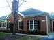Charming single-story brick home featuring manicured landscaping and classic architectural details at 8405 Olde Troon Dr # 4A, Charlotte, NC 28277
