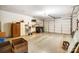 Spacious garage with storage shelves, room for multiple cars, and secure door at 8405 Olde Troon Dr # 4A, Charlotte, NC 28277
