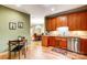 Inviting kitchen and breakfast nook area featuring wooden cabinets and stainless steel appliances at 8405 Olde Troon Dr # 4A, Charlotte, NC 28277