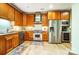 Spacious kitchen featuring custom wood cabinets, stainless steel appliances, and granite countertops at 8405 Olde Troon Dr # 4A, Charlotte, NC 28277