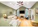 Spacious living room with vaulted ceiling, large windows, fireplace and hardwood floors at 8405 Olde Troon Dr # 4A, Charlotte, NC 28277