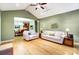 Open-concept living area with hardwood floors, connecting to the kitchen and dining area at 8405 Olde Troon Dr # 4A, Charlotte, NC 28277