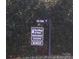 Community sign at the entrance that reads 