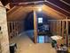 Unfinished attic space with pull-down stairs and ample storage at 8725 Bringle Ferry Rd, Salisbury, NC 28146