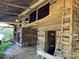 Barn interior with log cabin structure and ladder at 8725 Bringle Ferry Rd, Salisbury, NC 28146