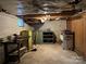 Unfinished basement with storage and workshop areas at 8725 Bringle Ferry Rd, Salisbury, NC 28146
