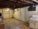 Unfinished basement with laundry hookups and storage area at 8725 Bringle Ferry Rd, Salisbury, NC 28146