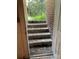 Exterior basement stairs leading to a brick home at 8725 Bringle Ferry Rd, Salisbury, NC 28146