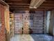 Unfinished basement with shelving for storage at 8725 Bringle Ferry Rd, Salisbury, NC 28146