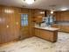 Kitchen with wood cabinets, tile floor, and a breakfast bar at 8725 Bringle Ferry Rd, Salisbury, NC 28146