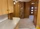 View from kitchen into hallway with brick accent wall at 8725 Bringle Ferry Rd, Salisbury, NC 28146