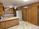 Kitchen with wood cabinets, tile floor, and white appliances at 8725 Bringle Ferry Rd, Salisbury, NC 28146