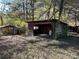 Various aged outbuildings nestled amongst trees at 8725 Bringle Ferry Rd, Salisbury, NC 28146