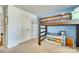 Charming bedroom with a bunk bed setup featuring built-in shelves and ample closet space for storage at 10238 Highland Creek Cir, Fort Mill, SC 29707