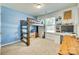 Bedroom showcasing a bunk bed with built-in storage, a desk, and natural light through the window at 10238 Highland Creek Cir, Fort Mill, SC 29707