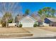 Charming single-Gathering home with a well-manicured lawn, a two-car garage, and a paved driveway at 10238 Highland Creek Cir, Fort Mill, SC 29707