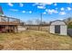 Landscaped backyard featuring a storage shed, pool, and deck at 103 Granville Ln, Salisbury, NC 28146