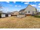 Backyard with pool, shed, and mature trees, creating a private outdoor space at 103 Granville Ln, Salisbury, NC 28146