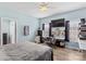 Light blue bedroom featuring modern ceiling fan and an abundance of natural light from two large windows at 103 Granville Ln, Salisbury, NC 28146