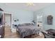 A light blue bedroom with wood-look floors features two doorways with one leading to a bathroom at 103 Granville Ln, Salisbury, NC 28146