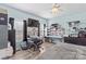 Light blue bedroom featuring modern ceiling fan and a spacious workstation with an abundance of natural light at 103 Granville Ln, Salisbury, NC 28146