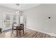 The dining area features wood-look flooring, space for four, and a sliding door with views of the backyard at 103 Granville Ln, Salisbury, NC 28146