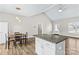 The dining area, and kitchen feature wood-look flooring, stainless steel appliances, and lots of natural light at 103 Granville Ln, Salisbury, NC 28146