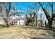 House with a large backyard, featuring mature trees at 115 E Geroid St, Salisbury, NC 28144