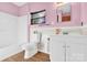 Clean bathroom with white vanity and bathtub at 115 E Geroid St, Salisbury, NC 28144