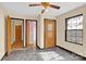 Bedroom with two doors and a window, featuring wood flooring at 115 E Geroid St, Salisbury, NC 28144