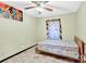 Small bedroom with tile floors and ceiling fan at 115 E Geroid St, Salisbury, NC 28144