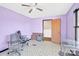 Spacious bedroom with two chairs and glass-top desk at 115 E Geroid St, Salisbury, NC 28144