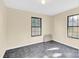 Simple bedroom with two windows and dark flooring at 115 E Geroid St, Salisbury, NC 28144