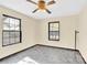 Bright bedroom with two large windows and dark flooring at 115 E Geroid St, Salisbury, NC 28144