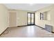 Cozy living room features a door, window, and tiled floor at 115 E Geroid St, Salisbury, NC 28144