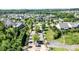 Aerial view of the community showcasing its well-maintained homes, lush greenery, and central water feature at 11508 Dublin Crescent Rd, Cornelius, NC 28031