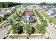 Aerial view of the community clubhouse with a tennis court and lots of green space at 11508 Dublin Crescent Rd, Cornelius, NC 28031