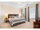 This bedroom features neutral walls, lots of natural light, and a simple yet elegant style at 11508 Dublin Crescent Rd, Cornelius, NC 28031