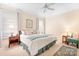 Cozy bedroom featuring natural light, a ceiling fan, and hardwood flooring at 11508 Dublin Crescent Rd, Cornelius, NC 28031