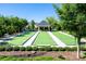 Enjoy the bocce ball court surrounded by lush landscaping and seating, perfect for outdoor gatherings at 11508 Dublin Crescent Rd, Cornelius, NC 28031