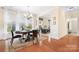 Elegant dining room featuring a chandelier and natural light, hardwood flooring at 11508 Dublin Crescent Rd, Cornelius, NC 28031