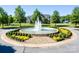 Beautiful fountain at the Bailey's Glen entrance, surrounded by colorful flowers and landscaping at 11508 Dublin Crescent Rd, Cornelius, NC 28031